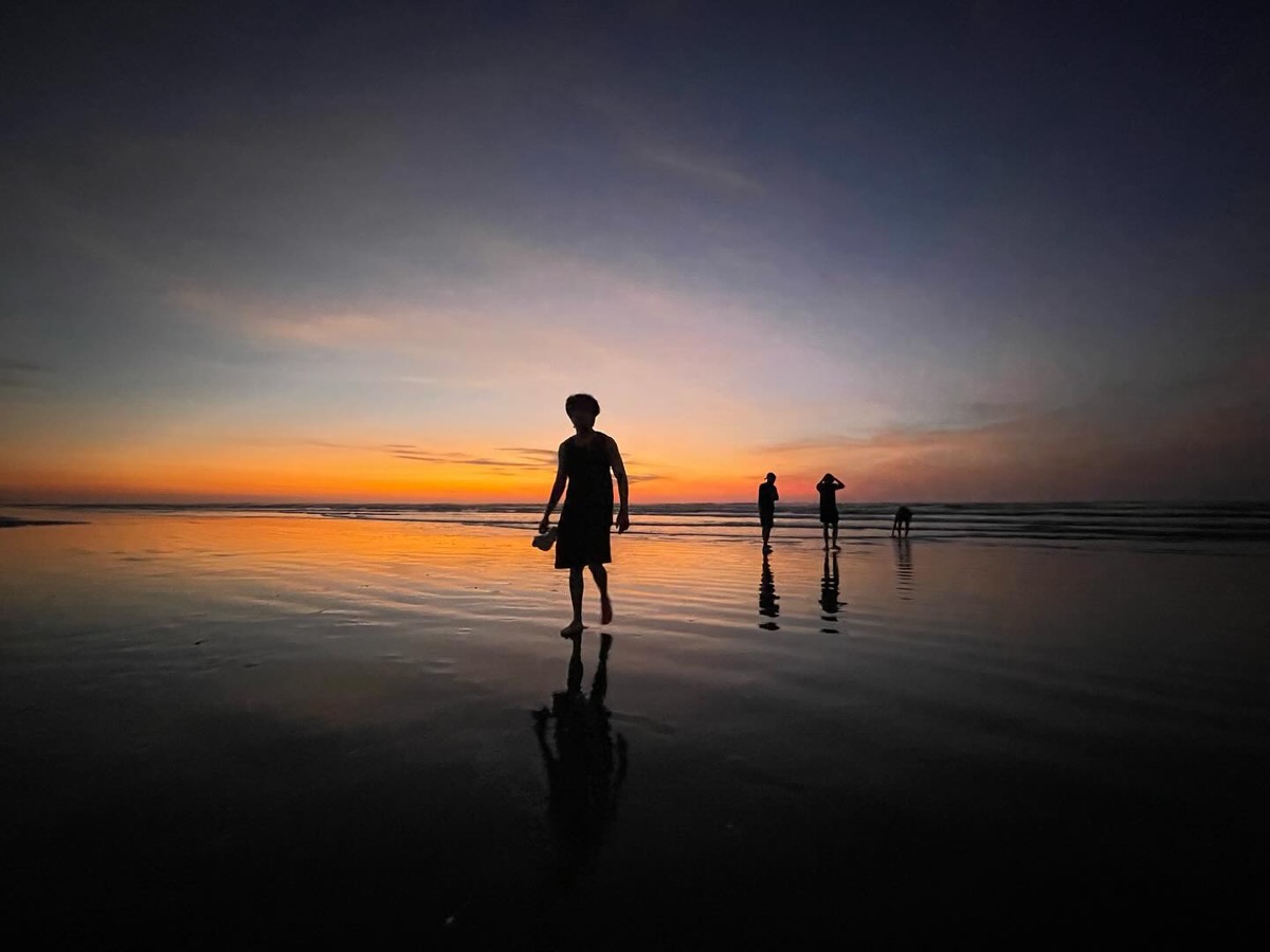Silhouettes on the beach at sunset